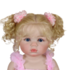Close-up detail of Aubrey Rose reborn toddler showing realistic hand-painted skin texture and sparkling blue eyes
