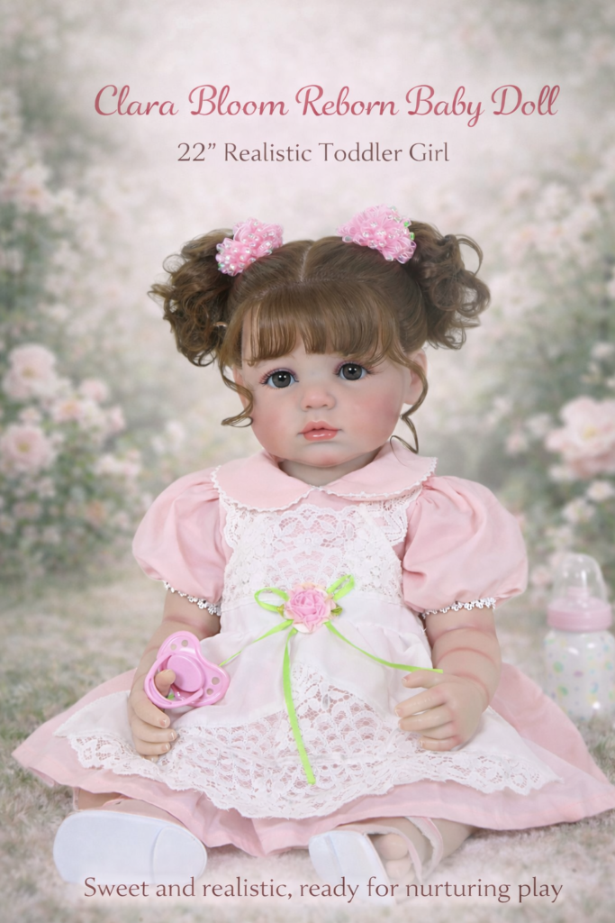 Stunning Clara Bloom 22-inch realistic reborn toddler girl doll with full vinyl body and rooted brunette curls in a pink lace dress