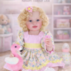 realistic reborn toddler doll Sunny Flamingo Girl with blonde curly hair detailed face poseable vinyl body and soft flamingo toy