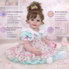 Festive Happy Birthday Girl reborn toddler features including hand-rooted brown hair expressive eyes 3D hand-painted face details and full soft vinyl body