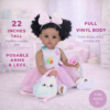 Poseable full vinyl body of Play Day Amaya 22-inch realistic toddler girl sitting in a nursery setting