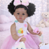 Poseable full vinyl body of Play Day Amaya 22-inch realistic toddler girl sitting in a nursery setting