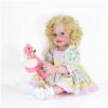 Radiant Sunny Flamingo Girl reborn toddler doll close-up featuring realistic hand-painted face brown eyes and curly blonde hair with a colorful bow