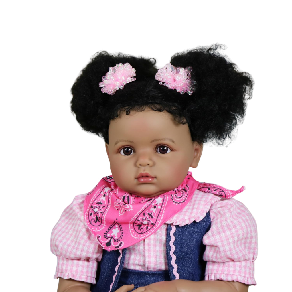 Close-up of Sweet Prairie reborn toddler girl showing realistic brown eyes, hand-rooted hair, and natural facial blushing.