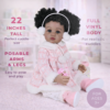 Adorable Play Day Amaya 22-inch African American reborn baby doll with full vinyl body in a pink plaid winter coat and earmuffs