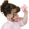 Butterfly Princess doll side view showing rooted brown curls and butterfly hair clip