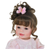 Butterfly Princess toddler doll close-up with lifelike eyes, soft features, and styled brown curls