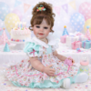 Happy Birthday Girl reborn toddler doll sitting with cake balloons and gifts holding pacifier and baby bottle