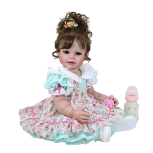 Happy Birthday Girl reborn toddler doll with brown curls wearing pastel birthday dress with pacifier and bottle