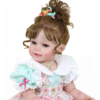 Close-up Happy Birthday Girl reborn doll with brown curly hair soft smile and lifelike hand-painted face