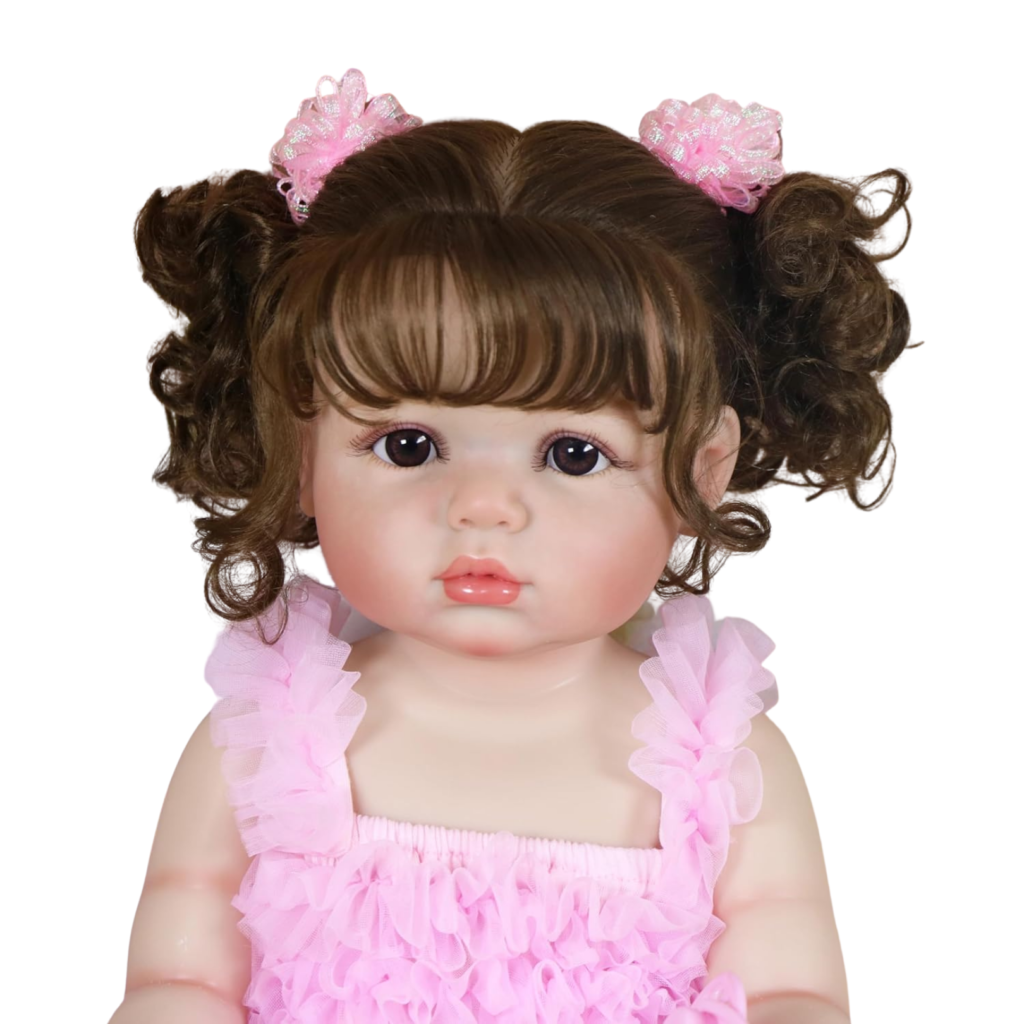 Close-up Madison in Pink reborn baby doll with lifelike hand-painted face brown eyes and soft expression