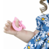 Sweet Dreams Daisy reborn doll hand holding pink pacifier with realistic fingers and soft vinyl skin detail