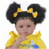 Sweet Sunshine Daisy reborn toddler doll close-up with brown eyes curly puff hairstyle and yellow bows