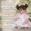 Clara Bloom 22 inch reborn doll with hand-painted face rooted brunette curls full vinyl body and detailed hands and feet