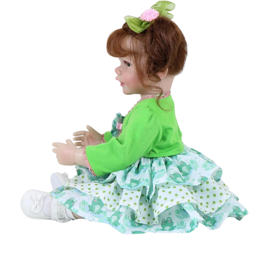 Froggy Girl reborn toddler doll side view showing layered dress and curly brown pigtails