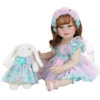reborn toddler doll with bunny toy and bottle full set white background