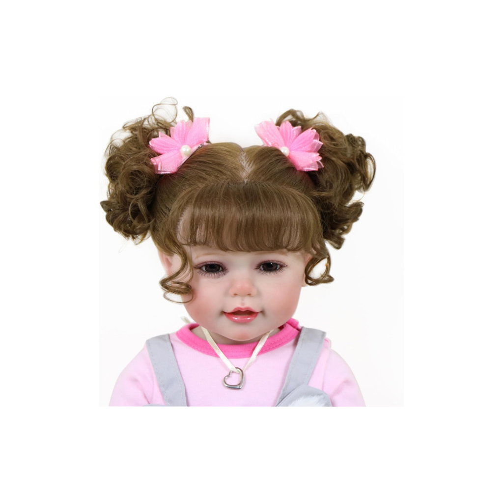 Realistic reborn baby doll girl with brown rooted hair in pigtails, lifelike eyes and soft vinyl face