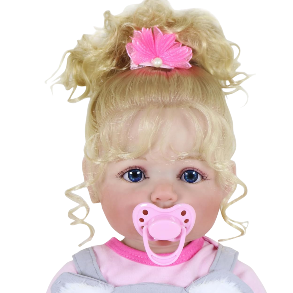 Close-up Luna Mae reborn baby doll with blue eyes blonde curls and pink pacifier lifelike facial details