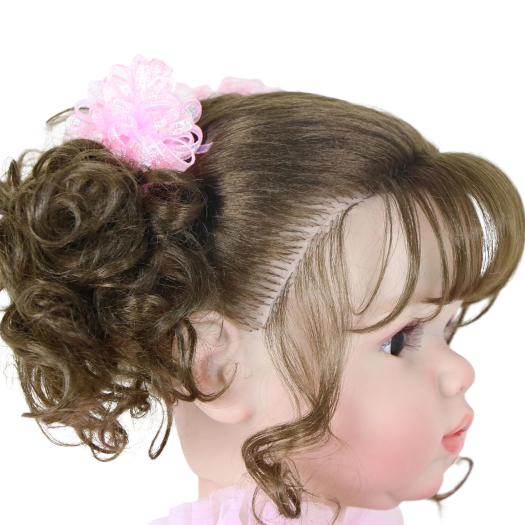 Close-up of rooted brown curly hair with pigtails and pink bows on reborn doll