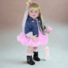 Rainbow Dreams reborn toddler doll wearing pink tutu dress denim jacket holding pacifier with baby bottle accessory