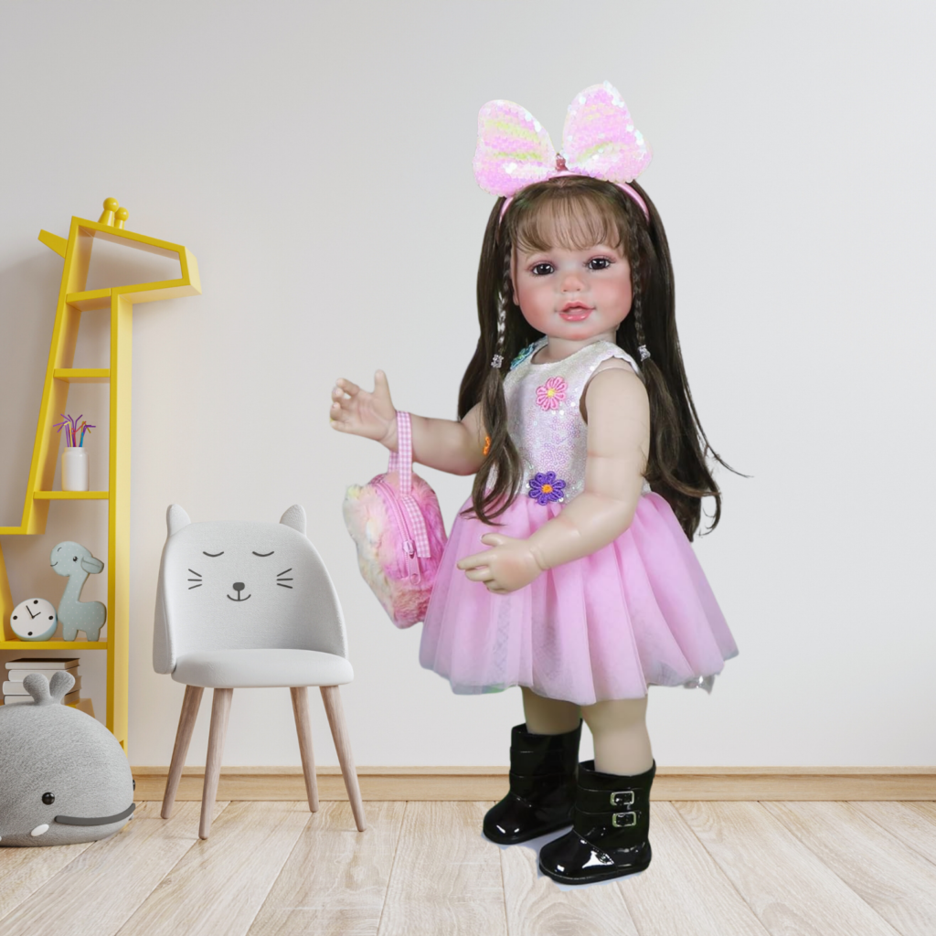 realistic reborn toddler doll standing in nursery with pink dress and bow headband