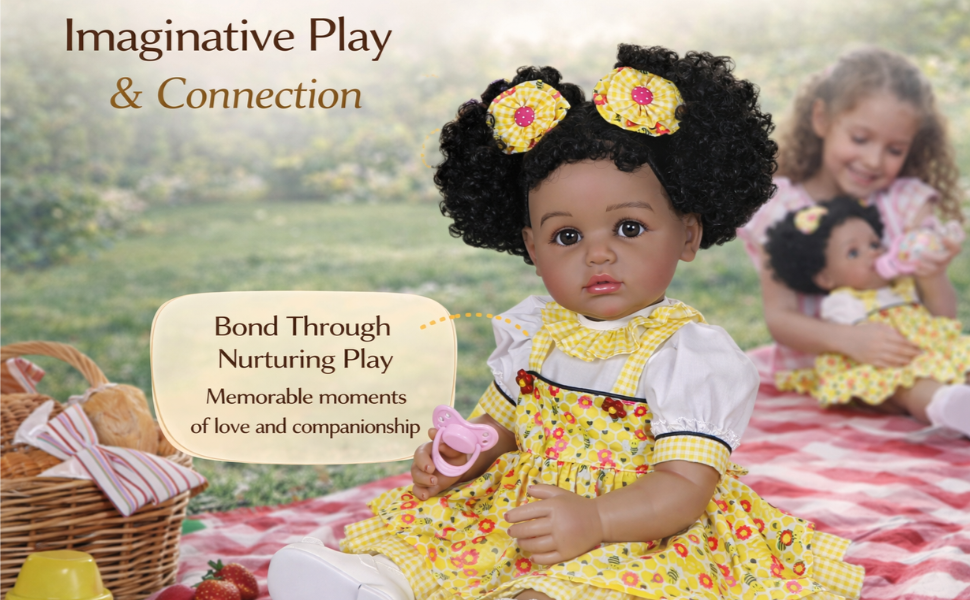 Sunny Mae reborn toddler doll in yellow dress on picnic blanket with girl playing in background