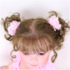 reborn doll rooted brown hair detail with pigtails and bows top view