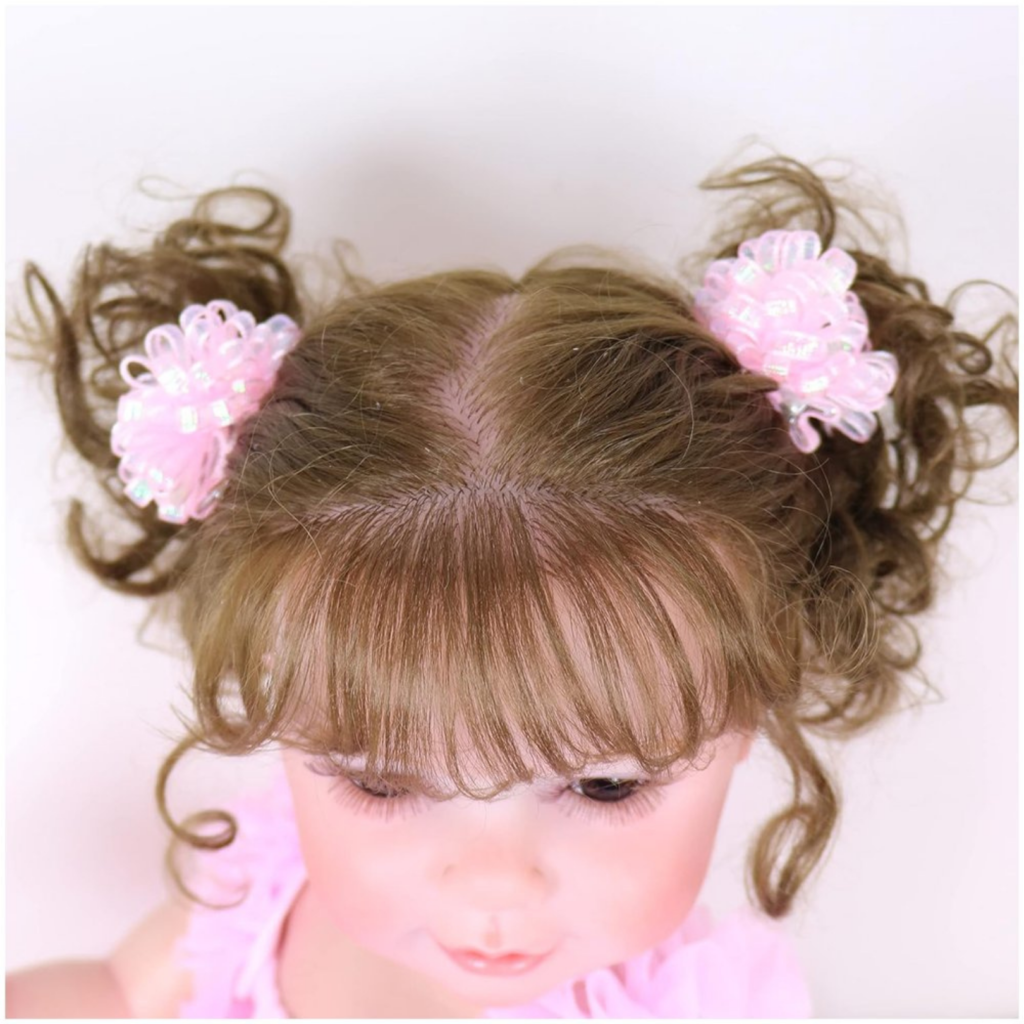 reborn doll rooted brown hair detail with pigtails and bows top view