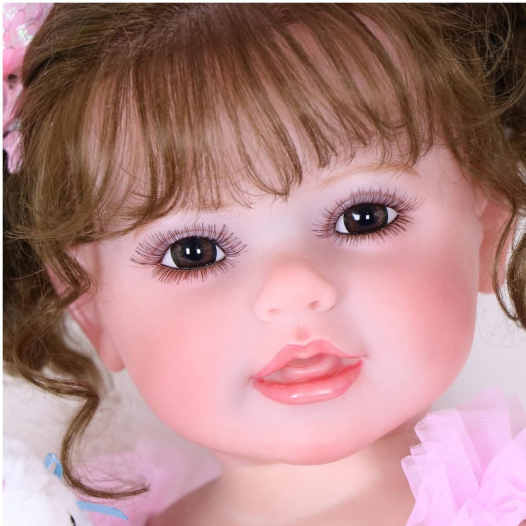 reborn toddler doll face close up realistic eyes lashes and glossy lips