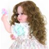 Sweet Curly Sunshine reborn doll side view showing long curly brown hair and pastel bow with detailed outfit