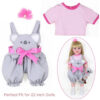 22 inch doll wearing koala overall outfit with pink shirt and matching accessories for imaginative play