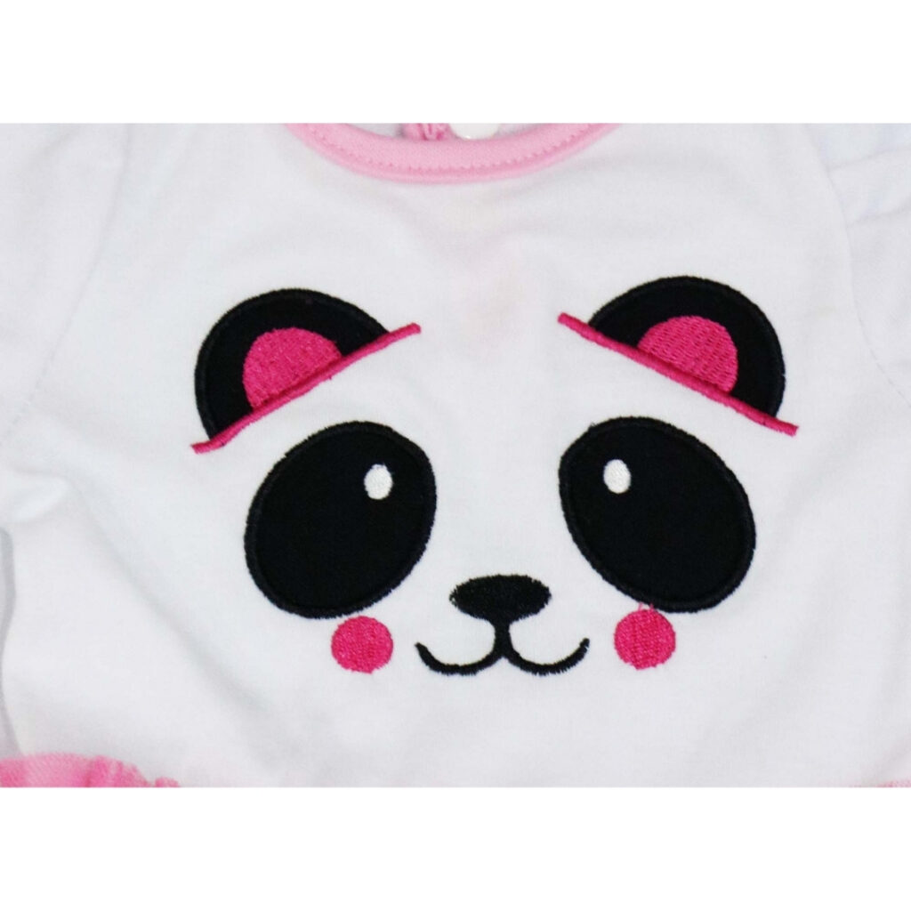 Close up panda face design on doll dress with embroidered eyes and pink details