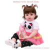 22 inch doll wearing panda face tutu outfit with pink dress and black leggings for pretend play