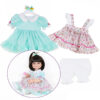 20 to 22 inch doll wearing pastel cupcake ruffle dress outfit with bloomers and matching hair bow