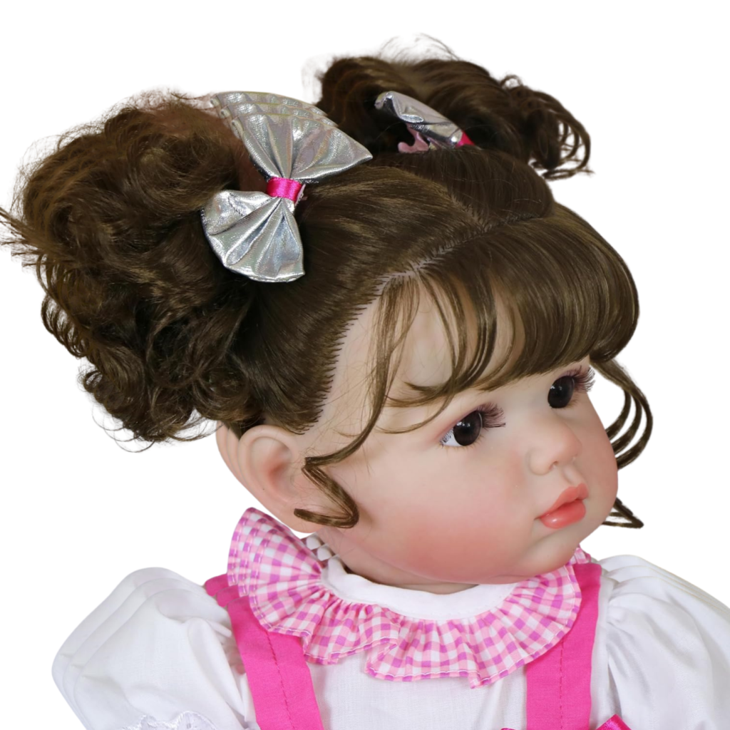 Side profile of Stella Rae reborn toddler doll showing curly brunette pigtails silver bows and detailed face