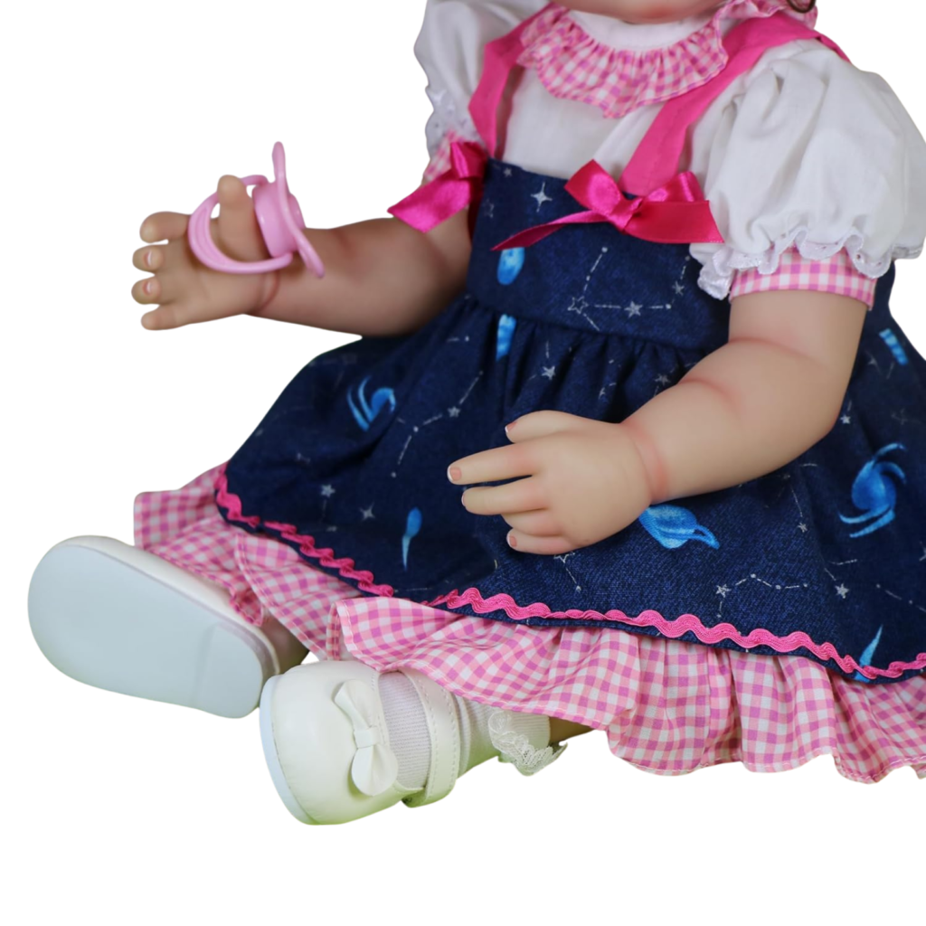 Close up of Stella Rae galaxy dress with pink gingham ruffles ribbon bows and detailed stitching