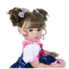 Stella Rae reborn doll holding magnetic pacifier showing detailed hands and realistic skin texture