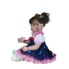 Stella Rae reborn doll angled view highlighting galaxy dress pink trim and realistic toddler features