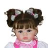 Close up of Stella Rae reborn doll face with brown eyes soft lips and realistic hand painted details